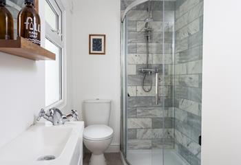 Wash off your sandy toes in the modern shower room.