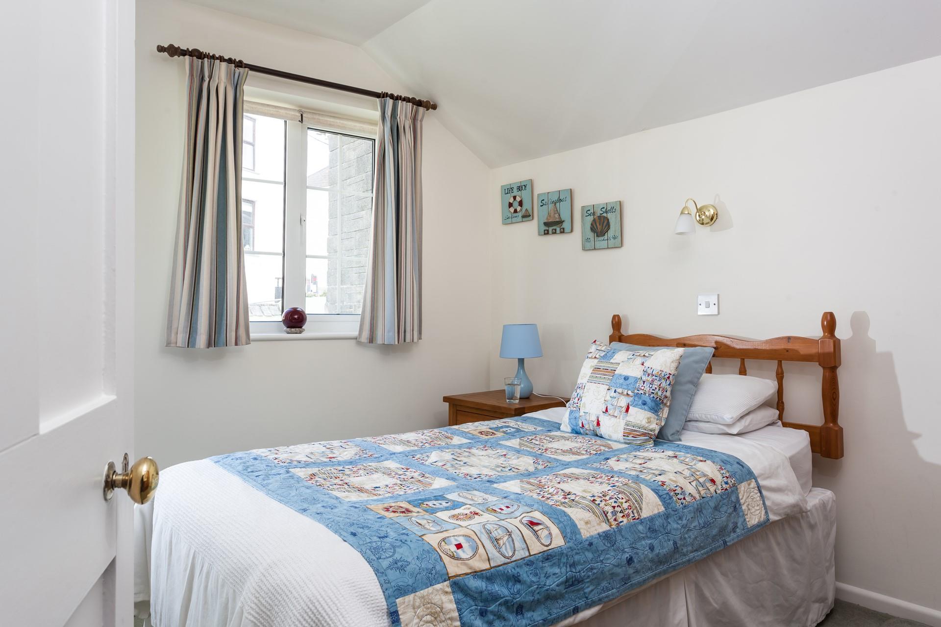 Bedroom 1 has a single bed for a peaceful night's sleep after busy days.