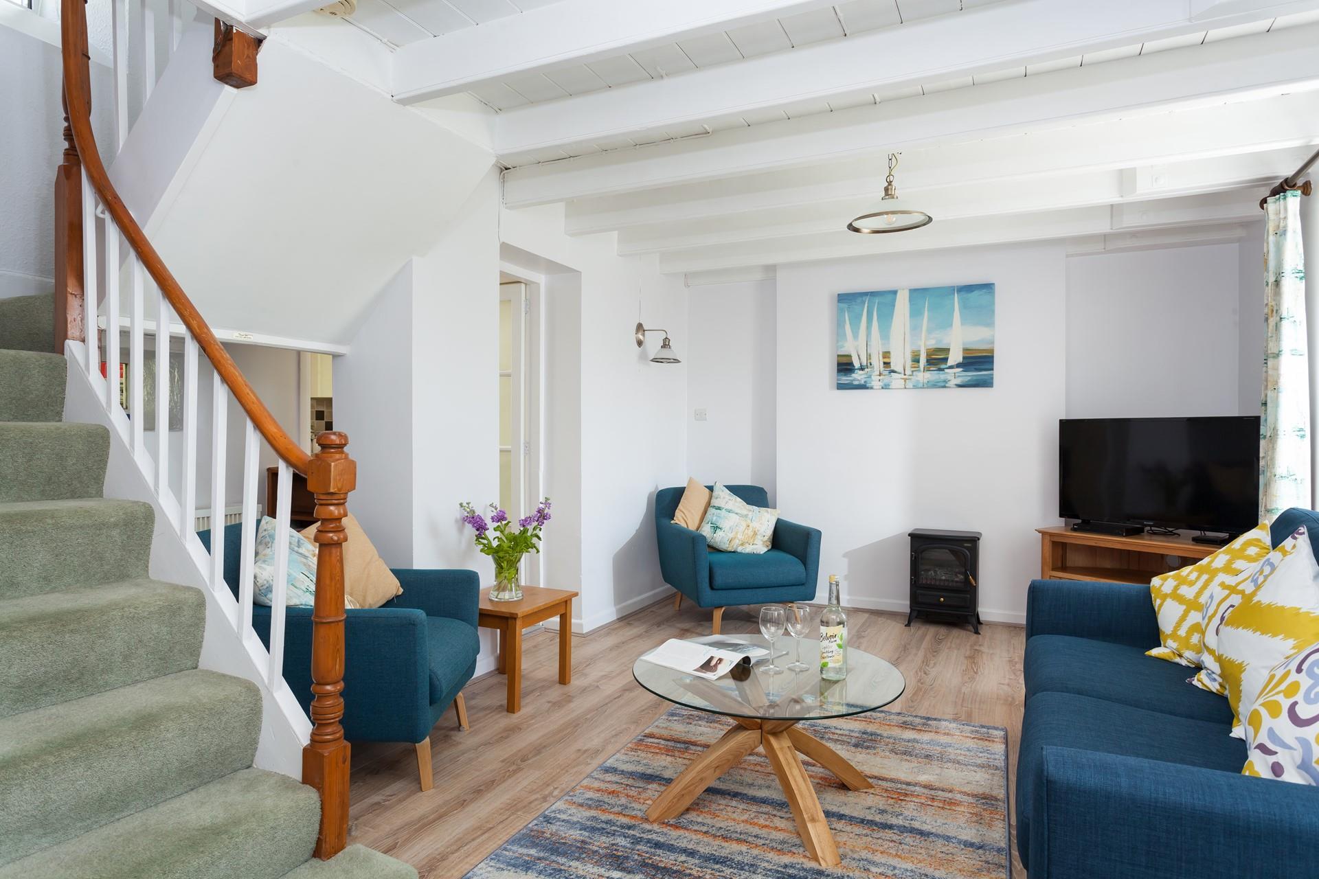 The sitting room has comforting blue decor and is the perfect spot to unwind.