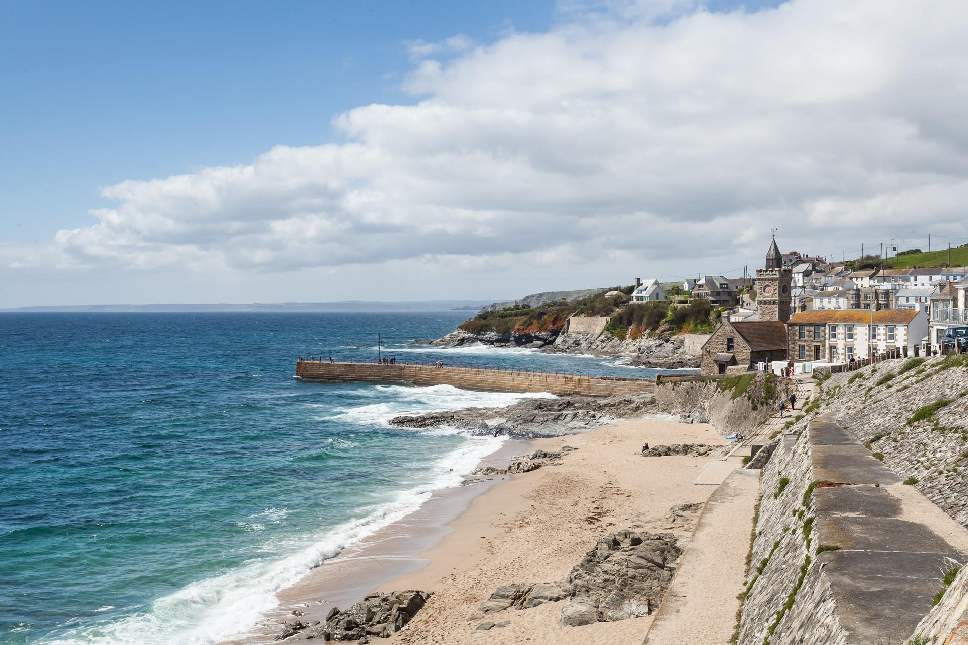 Watch the surfers ride the waves of Porthleven's famous surf break. 
