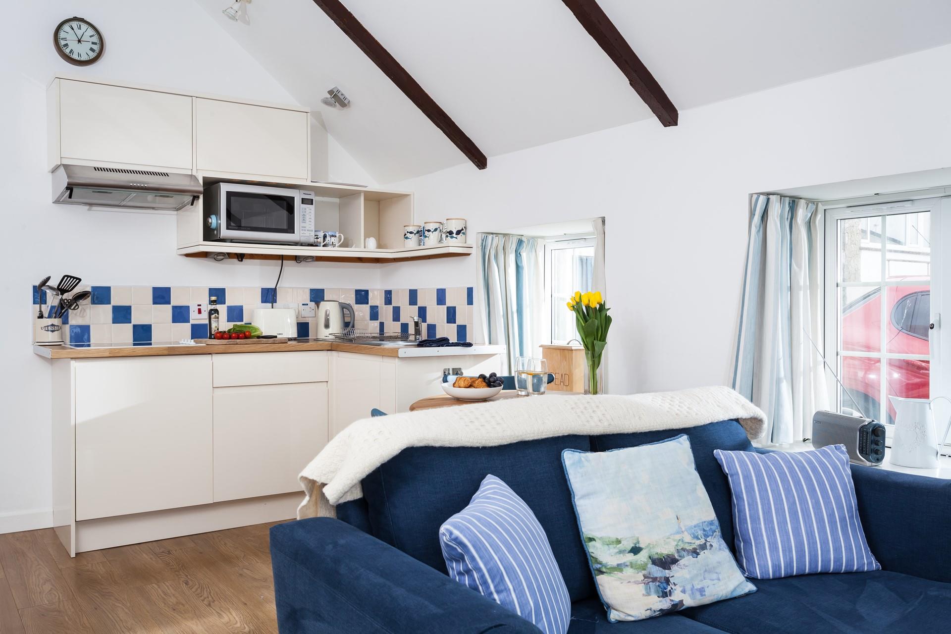 This open plan sitting, kitchen, dining area is the perfect space to relax and unwind after a day of exploring. 