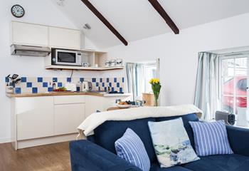 This open plan sitting, kitchen, dining area is the perfect space to relax and unwind after a day of exploring. 