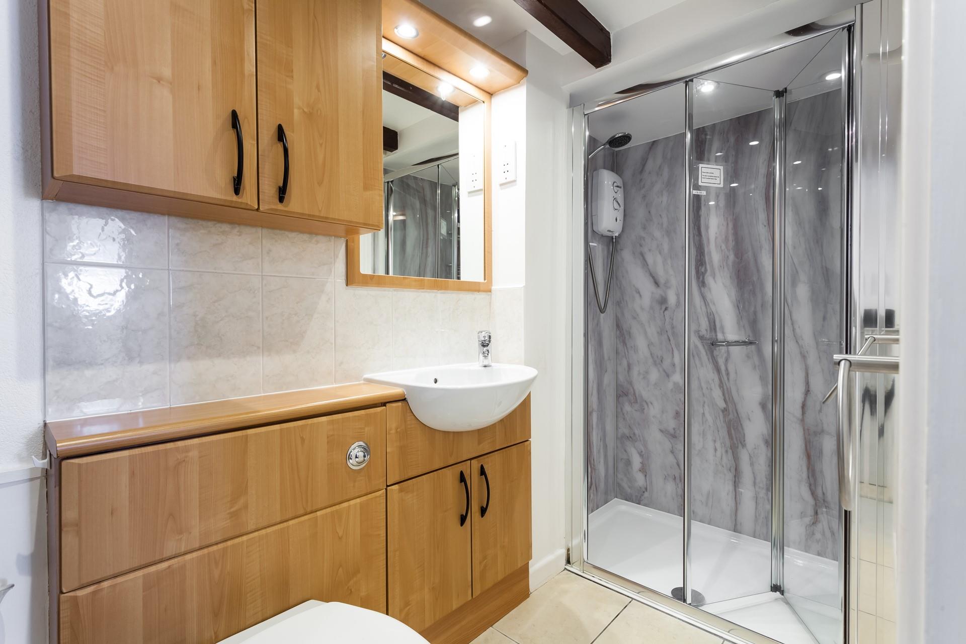 Wash off those sandy toes in this light and modern shower room. 