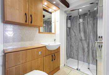 Wash off those sandy toes in this light and modern shower room. 