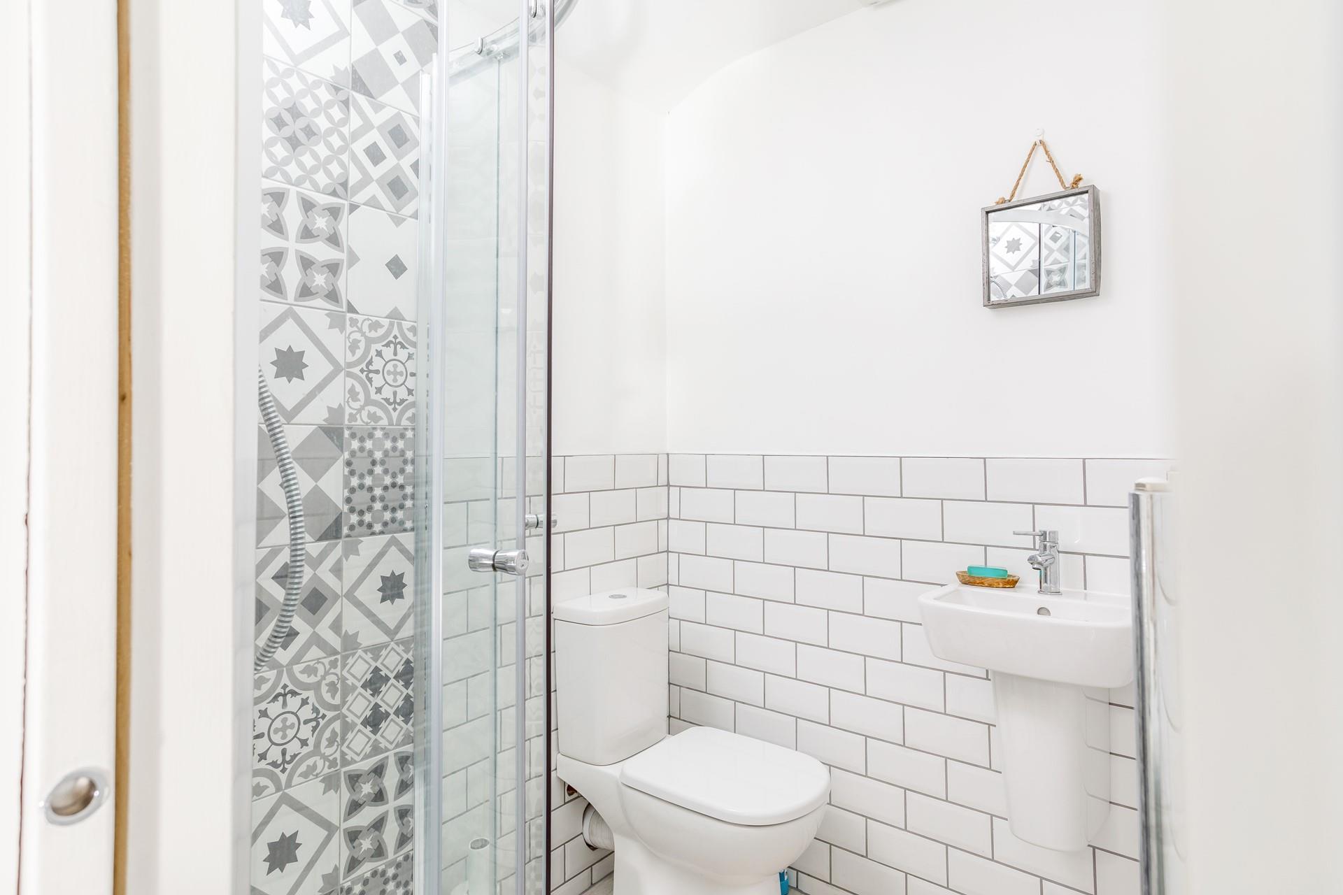 Get ready for the day in the en suite bathroom.