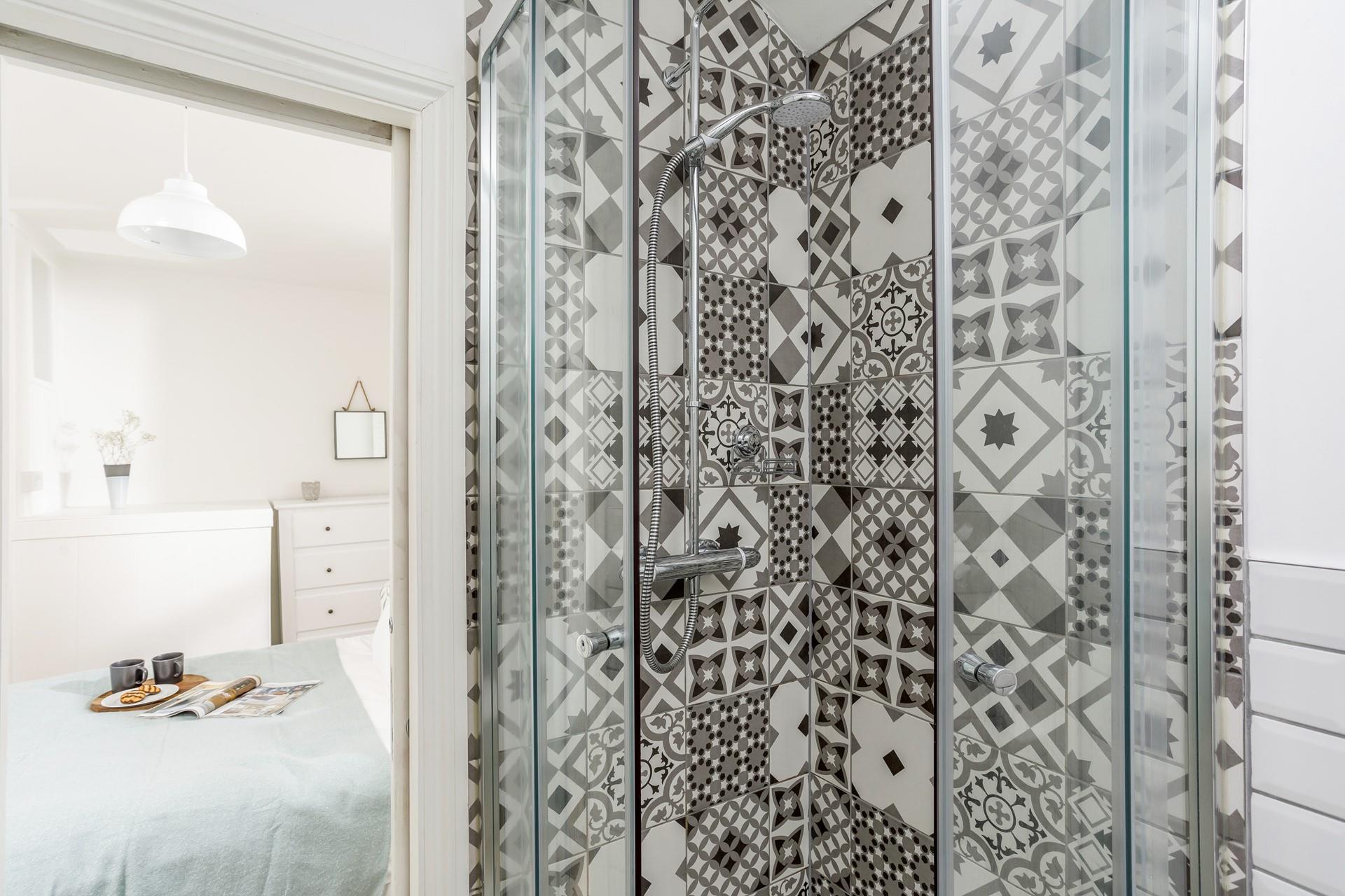 Wash off sandy toes in the shower after a day on the beach.