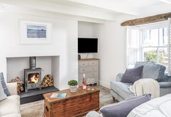 Light the woodburner and cosy up in the stylish sitting room each evening.
