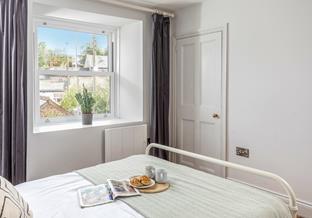 Bedroom 1 is situated at the front of the house and the calming space is perfect for a great night's sleep.