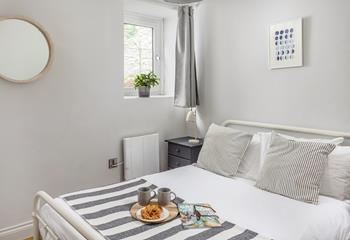 Bedroom 2 offers a cosy double bed, with open clothes rails for hanging up your holiday best. 