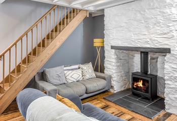 The cosy living space is just perfect for cuddling up on the sofa in front of the fire on chillier days.