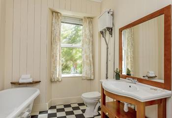 The family bathroom has a roll-top bath and a separate shower to choose between.