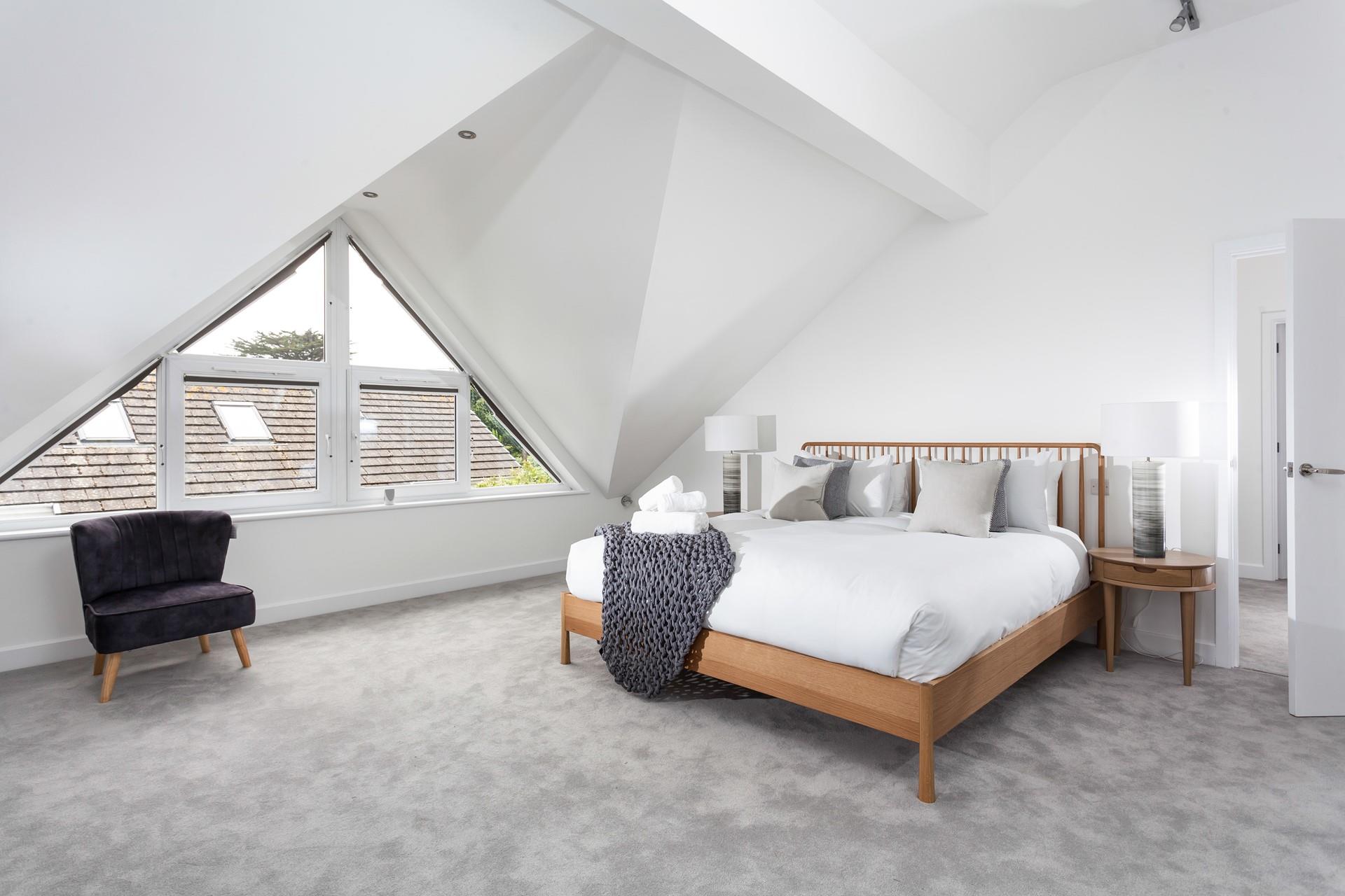 Bedroom 1 exudes luxury with the spacious super king size bed offering a peaceful night's sleep.