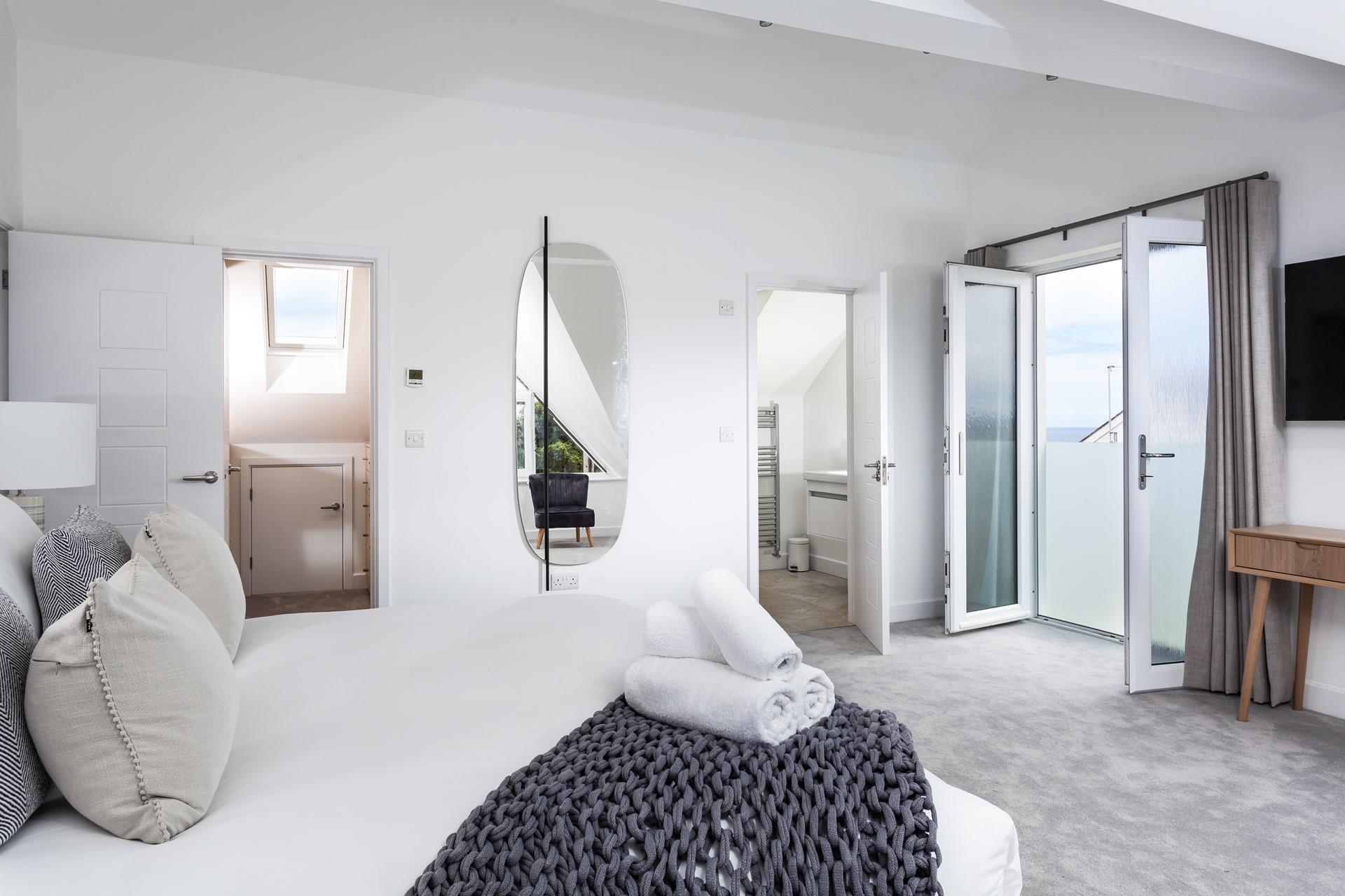 Open the doors to the Juliet balcony and gaze at the sea view while you sip your morning cuppa.