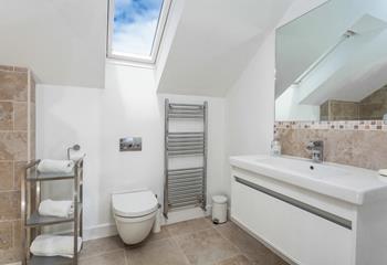 The en suite has a bath, shower and heated towel rail for warm fluffy towels in the morning.