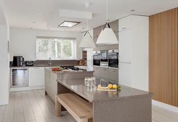 There's a spacious island, dual ovens, and a wine cooler!