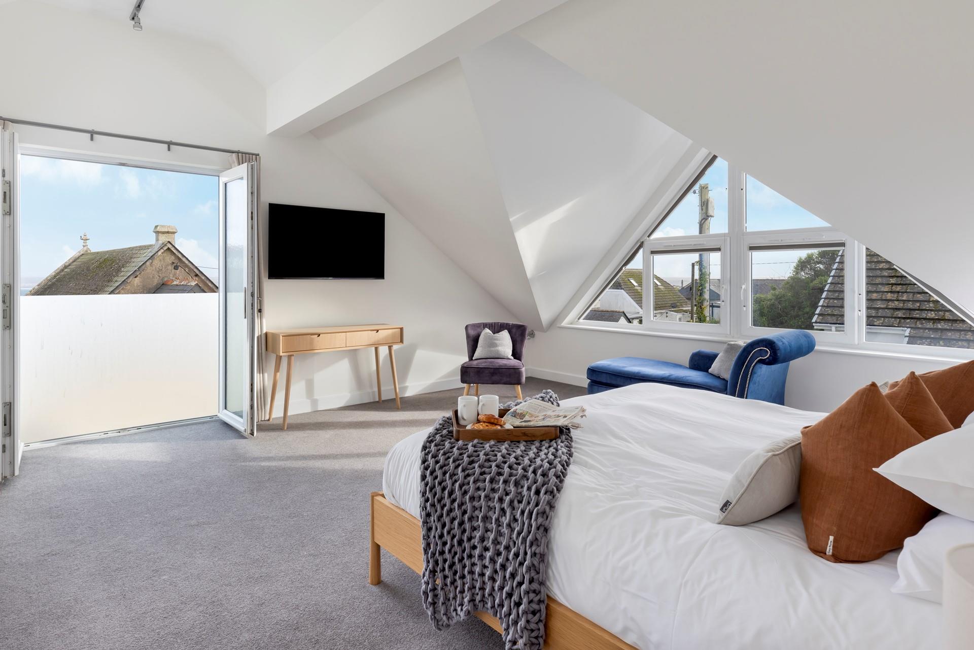 Bedroom 1 exudes luxury with the spacious super king size bed offering a peaceful night's sleep.