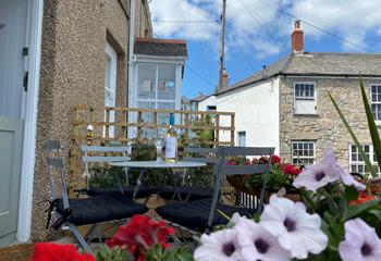 Indulge in a Cornish cream tea on the patio watching the comings and goings in the village.