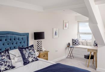 Nautical themed pictures fill the walls in bedroom 3.