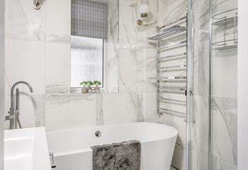 Relax and unwind in the modern bathroom and sink into a bubble bath.