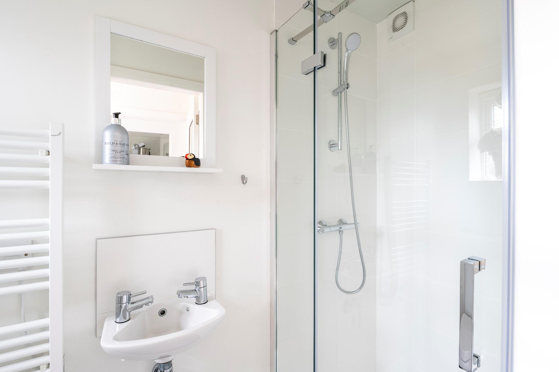 Wash off the sand in the shower after spending the day at a nearby beach.