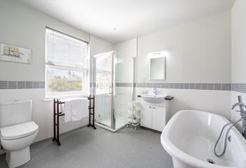 Choose between a bath or shower to start your day in the large bathroom.