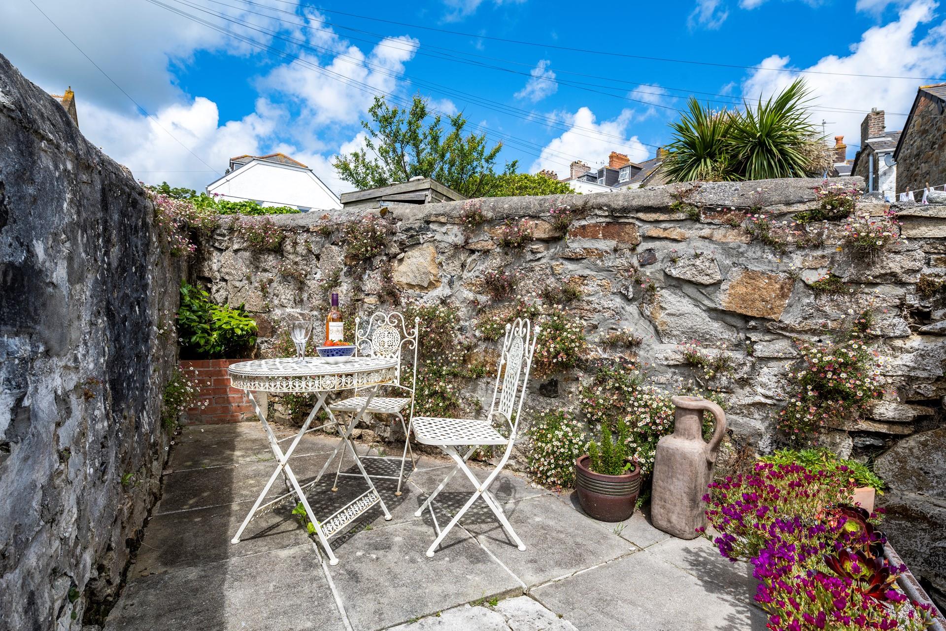 The suntrap garden offers the perfect spot for an afternoon tipple in the sun.