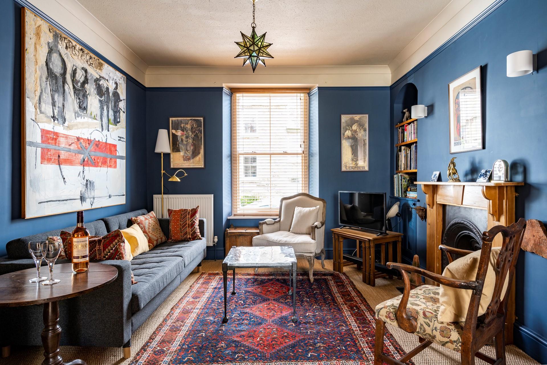 Caradoc showcases a mixture of antique furniture and a rich colour scheme, in keeping with this Victorian home.