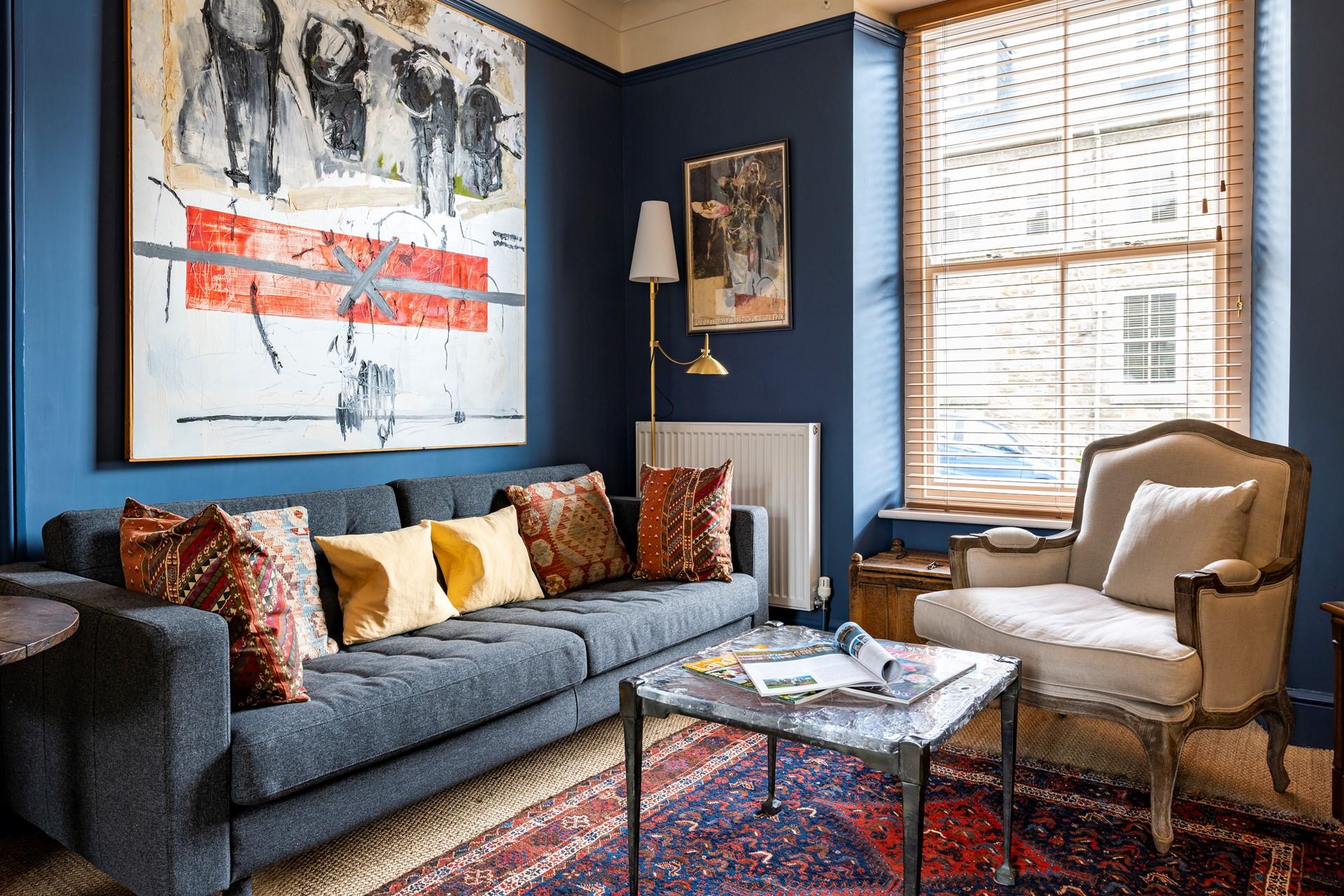 Striking artwork and cosy furnishings complete this eccentric home.