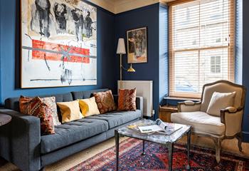 Striking artwork and cosy furnishings complete this eccentric home.