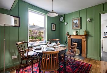 Sit around the dining table and enjoy a hearty meal after a day walking the coast path.