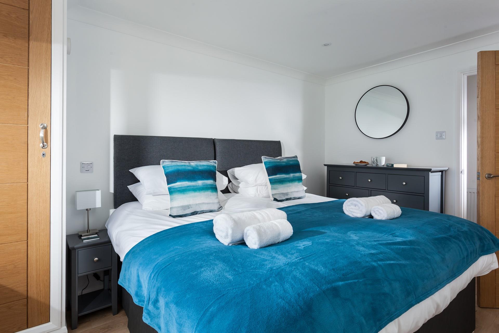 Soft sheets and white fluffy towels await you at the apartment.