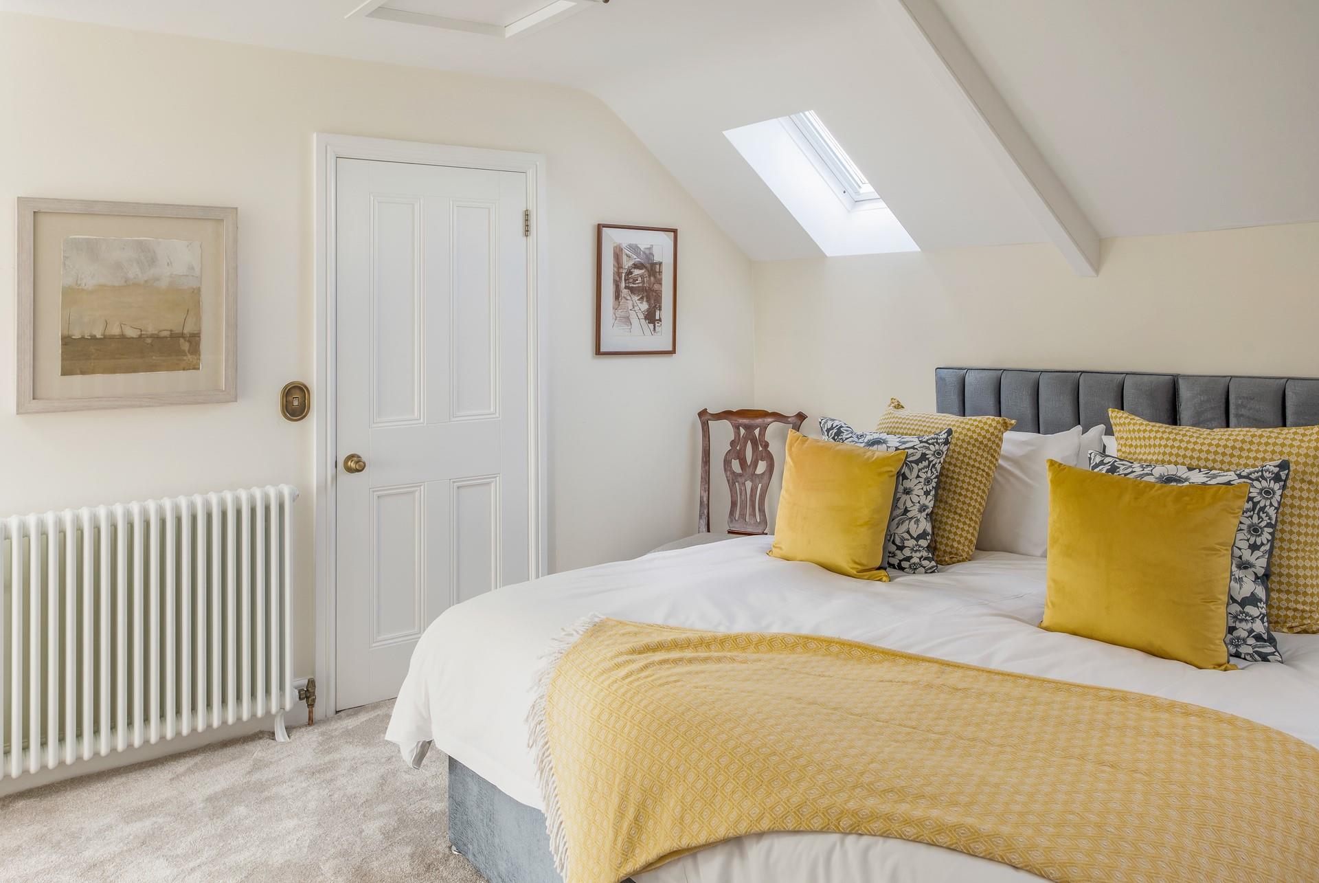 Bedroom 4 has a super spacious king size bed to tuck into each night.