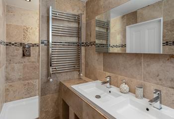 Double sinks in the en suite mean there is plenty of room to get ready for all guests.