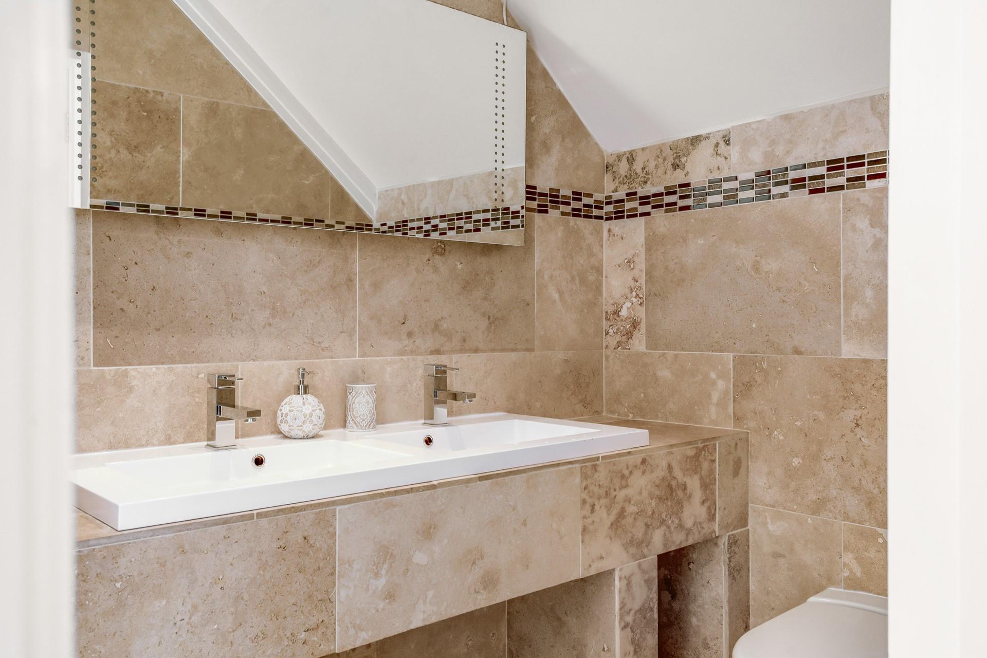 The stylish en suite is perfect for getting ready for an evening out.