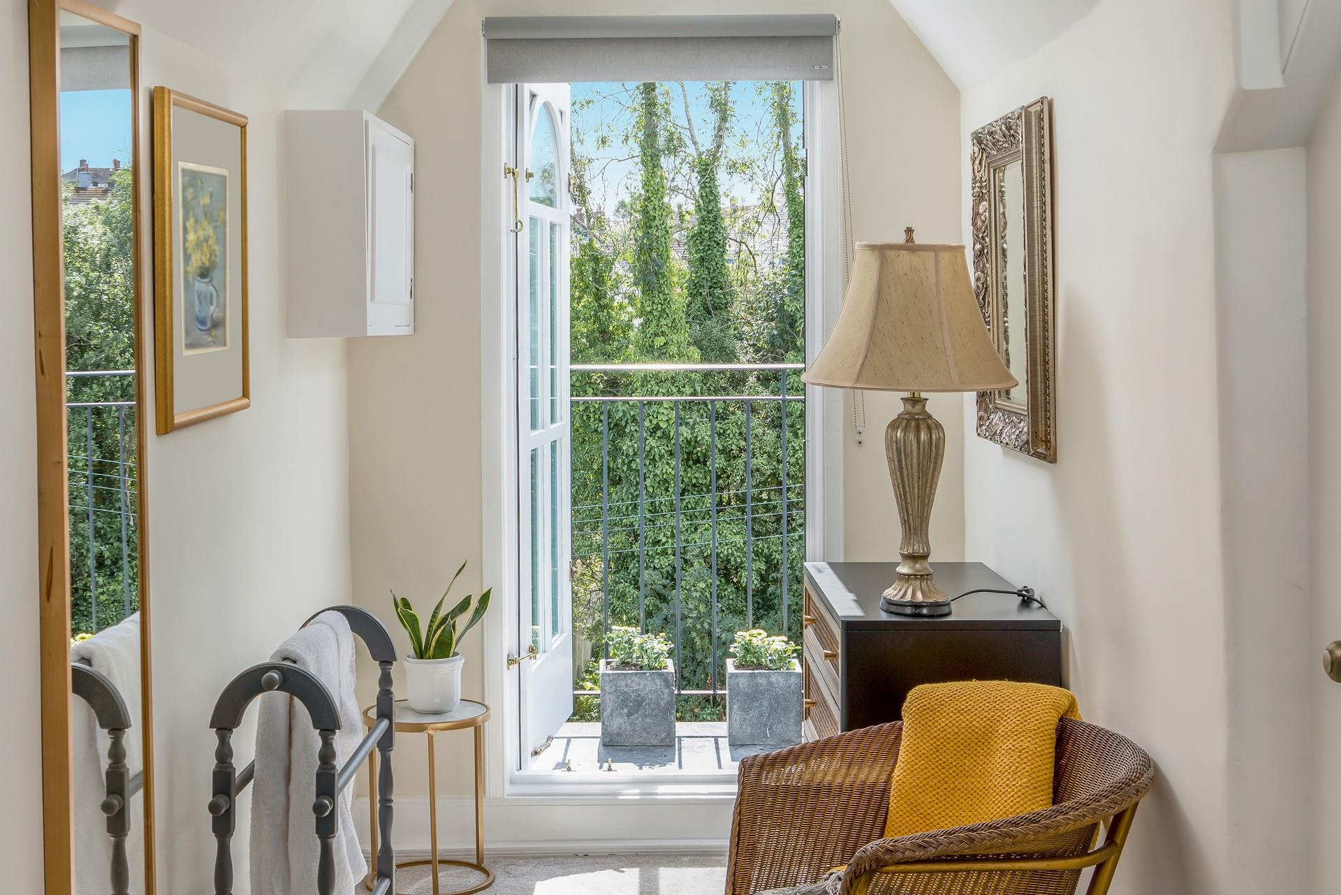 Wander out to the balcony to check on the weather for the day.