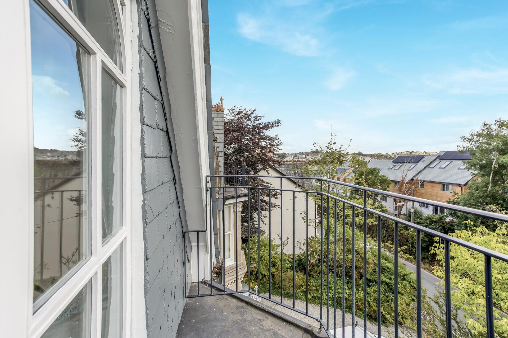 Wander out to the balcony and check the weather to make a plan for the day.