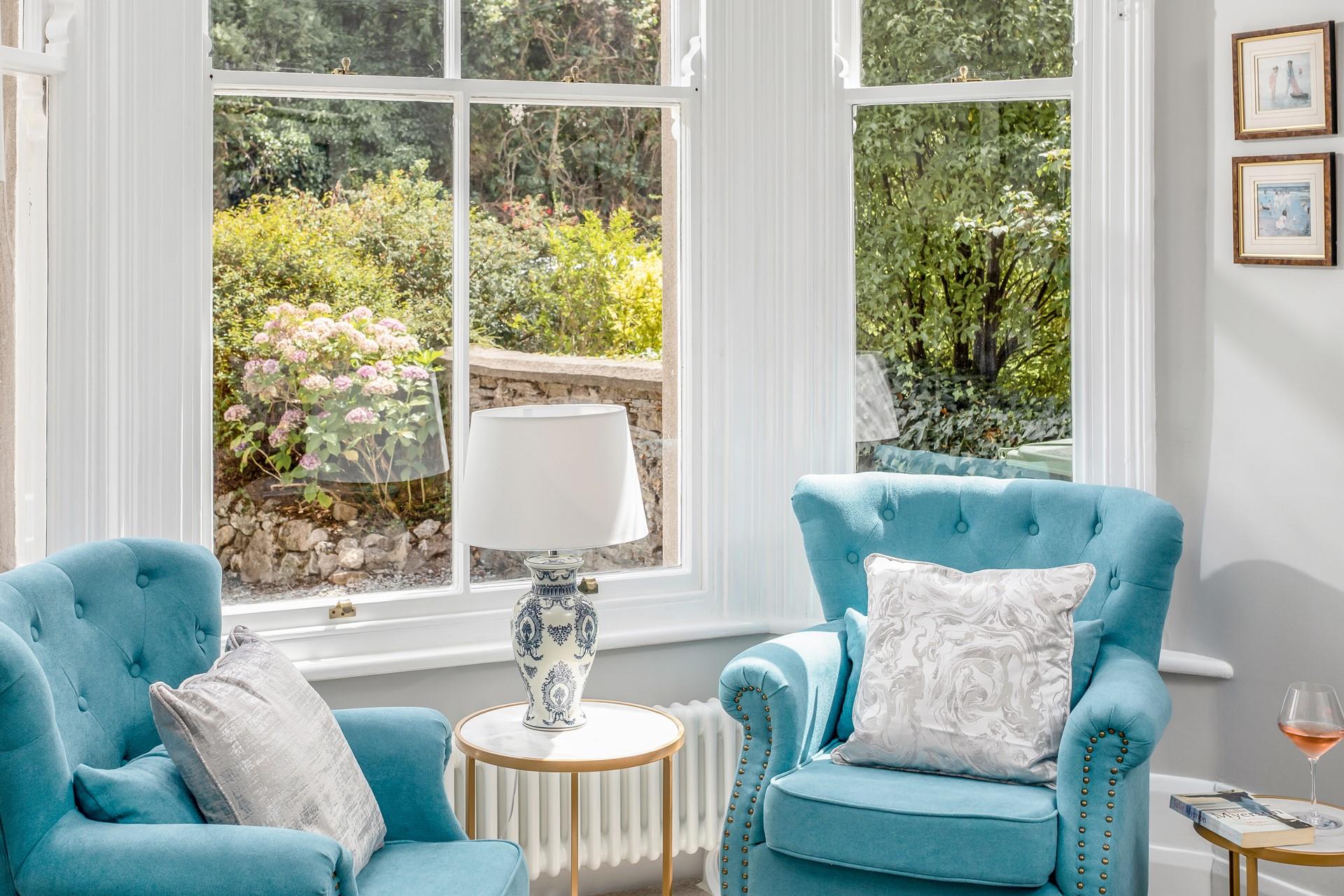 Take in the morning sunshine and relax in the comfy window chairs.