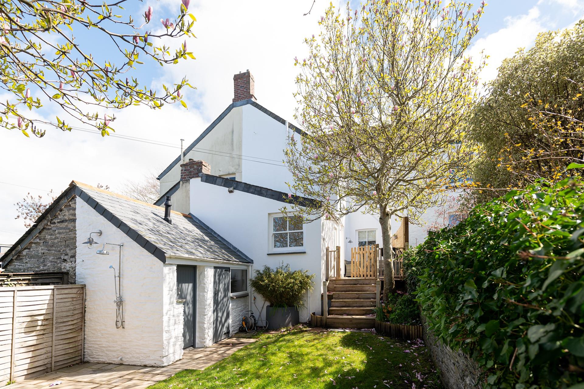 The outdoor shower is perfect for rinsing sandy toes or paws after a visit to the beach.