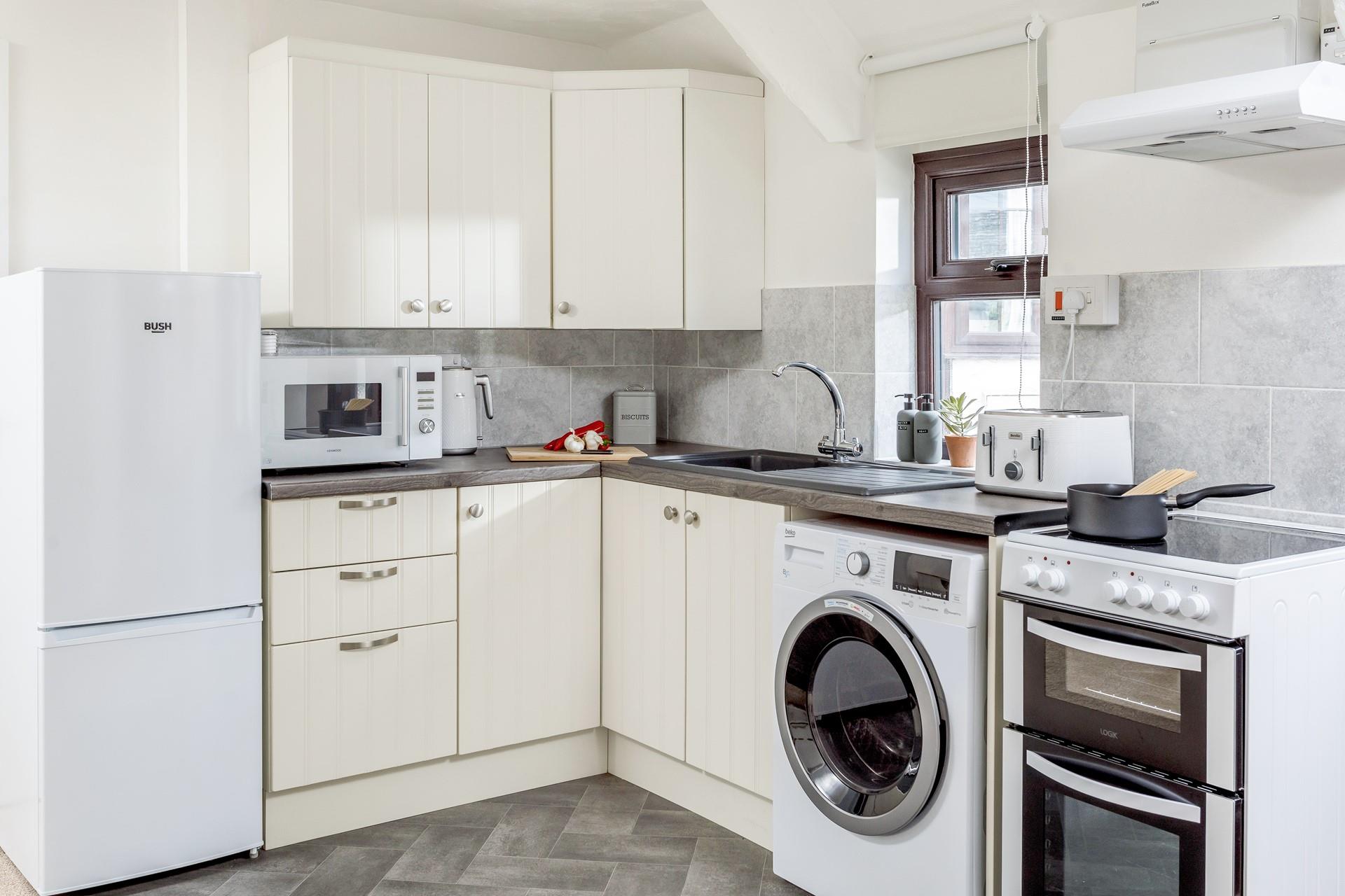 The kitchen is modern and fully equipped to cook up a storm.