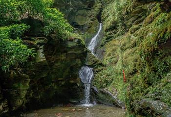 The magnificent 60-foot waterfall at St Nectan's Glen.