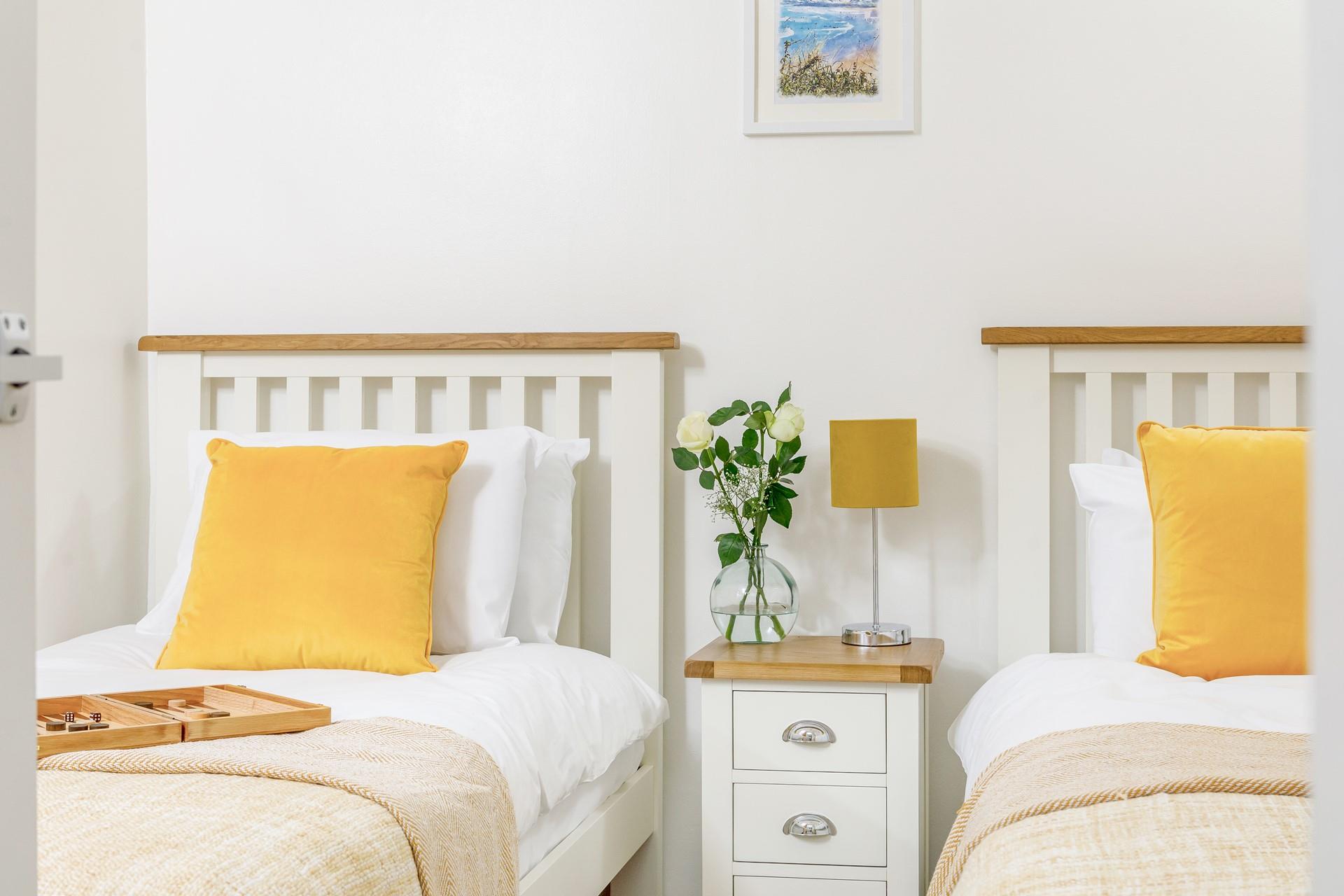 The twin beds are perfect for adults or children to snuggle into.