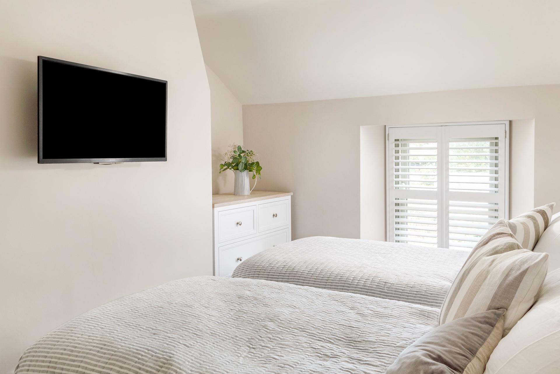 Cosy up in the comfortable twin beds for a good night's sleep after a fun filled day. 