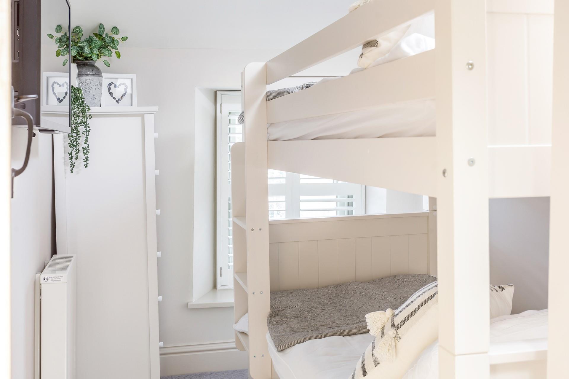 Children can enjoy a sleepover together and rest easy in the bunk beds in bedroom 3. 