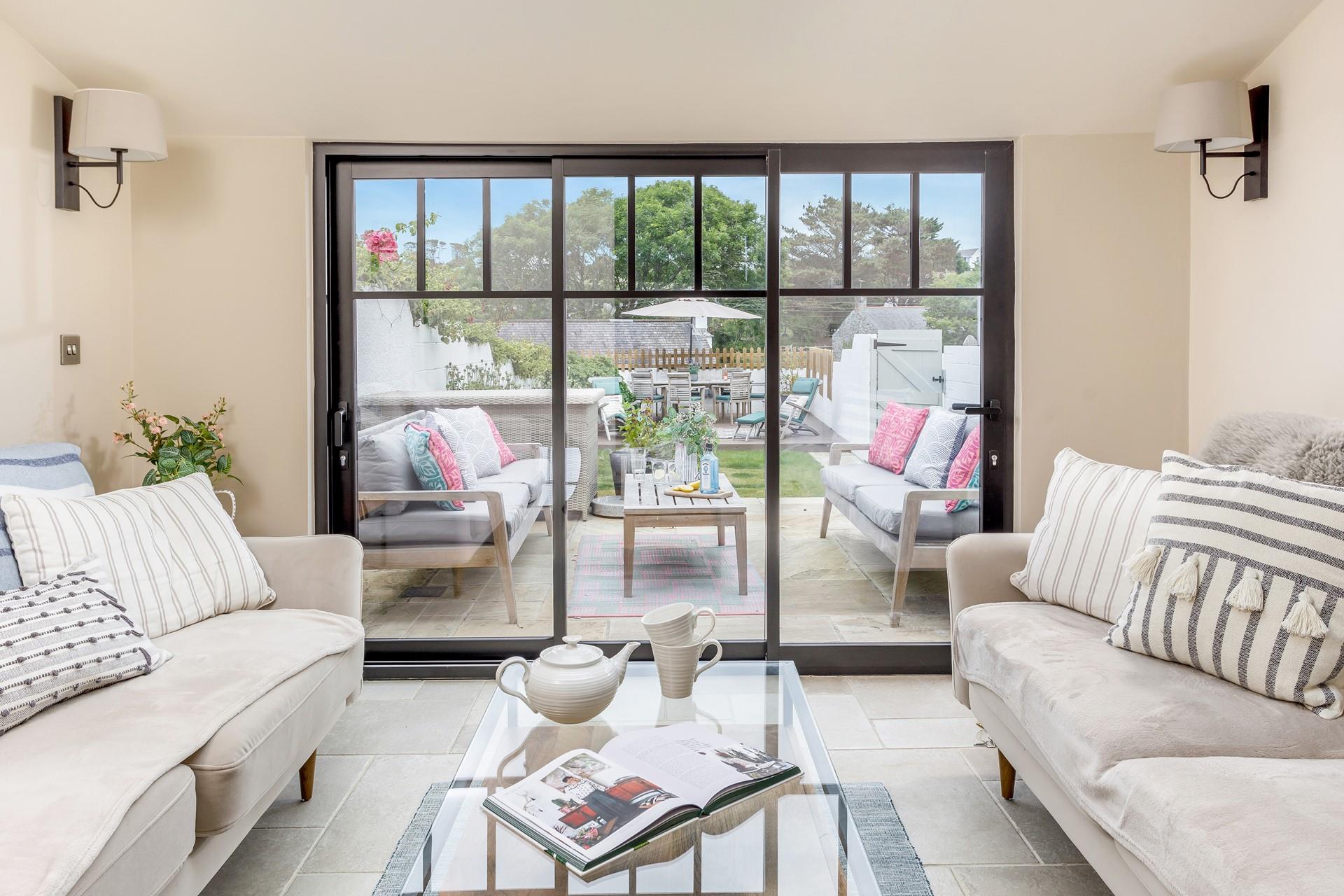 The sunroom looks out onto the garden, so you can enjoy a snooze whilst the air flows through the patio doors. 