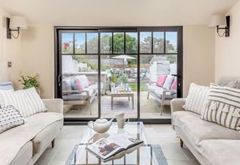 The sunroom looks out onto the garden, so you can enjoy a snooze whilst the air flows through the patio doors. 