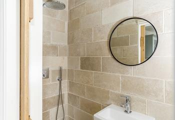 A convenient shower room set just off the kitchen, with a luxurious rainfall shower.