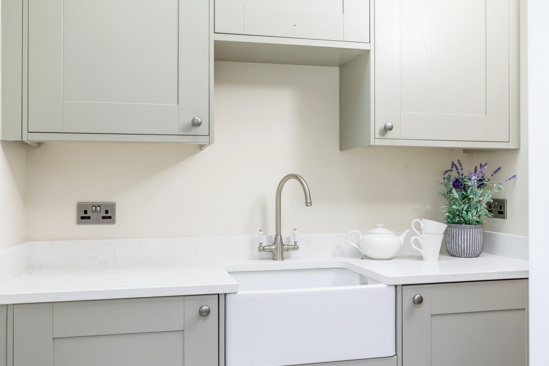 A washing machine and tumble dryer are housed in the handy utility room. 