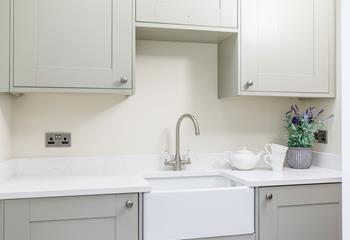 A washing machine and tumble dryer are housed in the handy utility room. 