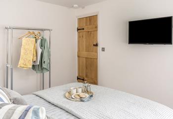 Each bedroom has gloriously comfy beds and a TV, perfect for a lazy morning.