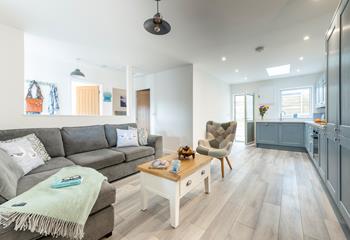 The open plan sitting room and the kitchen are stylishly finished whilst still keeping that homely feel.